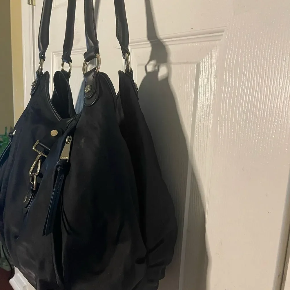Calvin Klein Black Nylon large shoulder bag with gold tone hardwares.